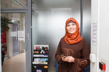 Image of female holding mobile phone